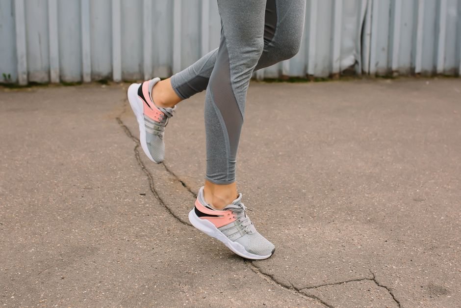 woman wearing cushioned athletic walking shoes