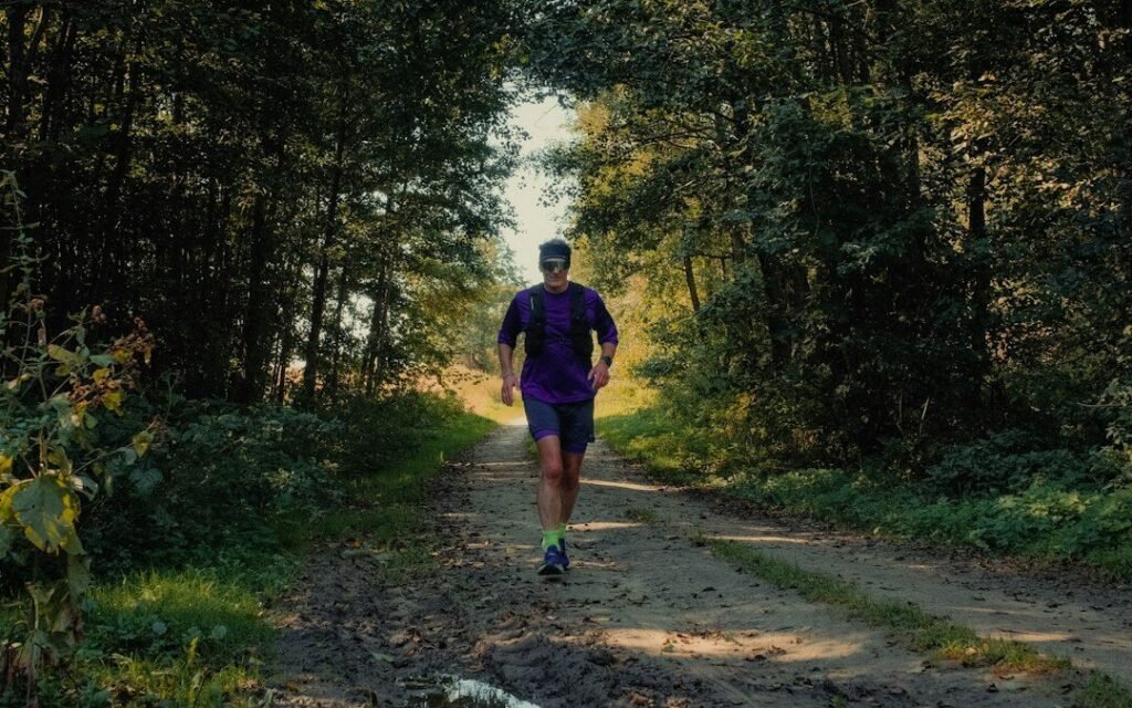 trail runner navigating rough terrain in supportive footwear