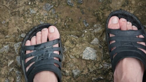 hiker wearing supportive sandals on a trail