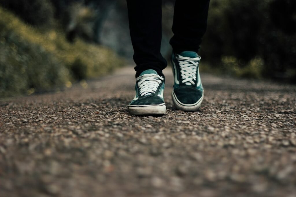 walker wearing supportive shoes on a walking path