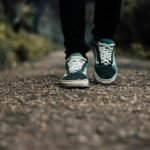 walker wearing supportive shoes on a walking path