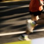runner in running shoes on a road
