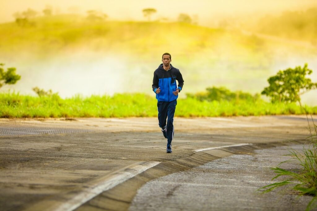 Runner wearing cushioned road running shoes on asphalt