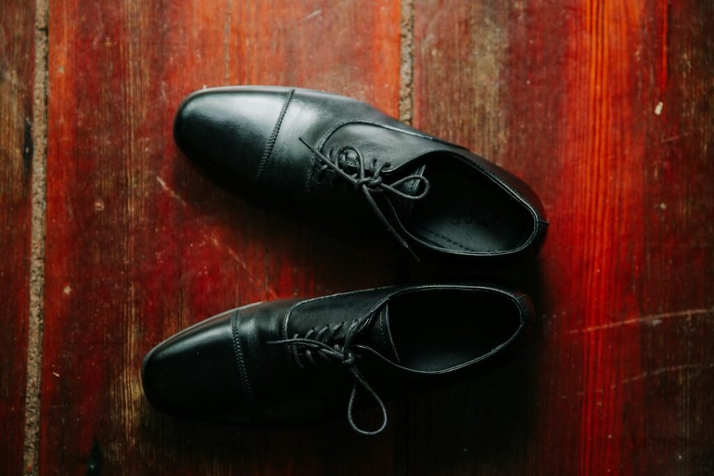 broad toe leather dress shoes beside tapered dress shoes