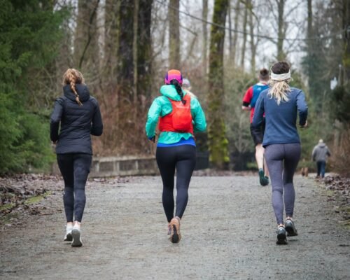 endurance runners logging weekend miles in modern cushioned footwear