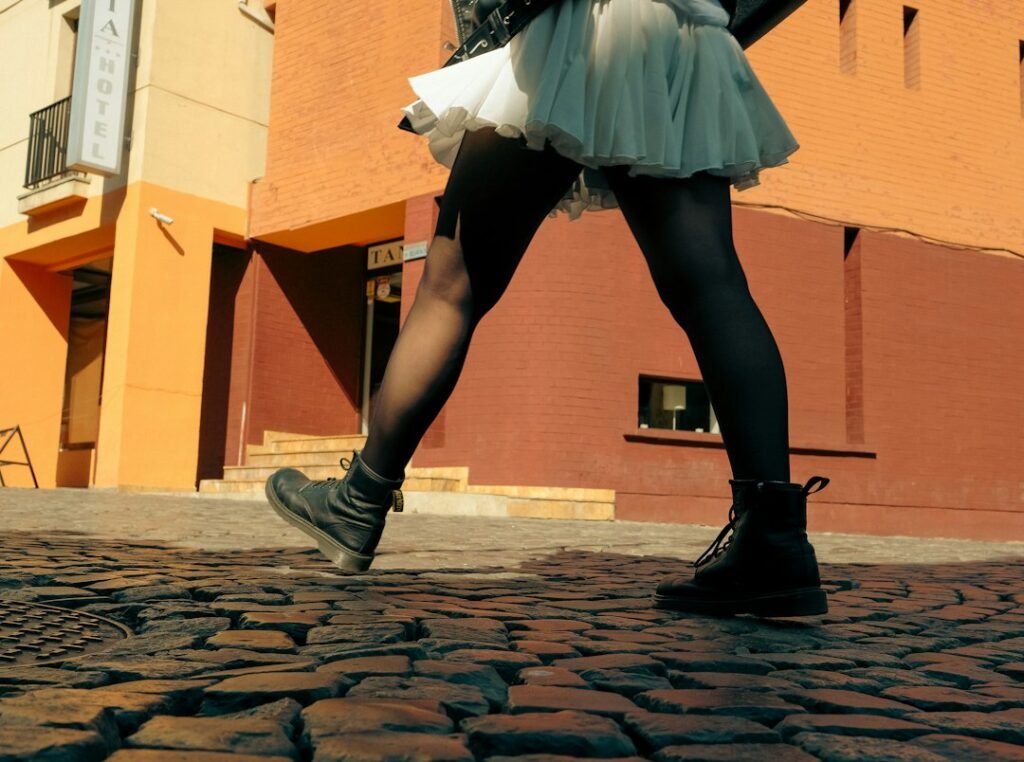 woman walking on European cobblestones