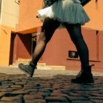 woman walking on European cobblestones