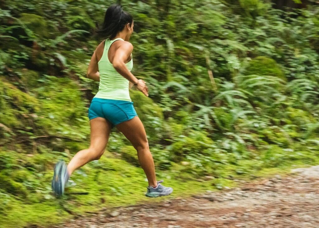runner wearing broad toe running shoes on a road