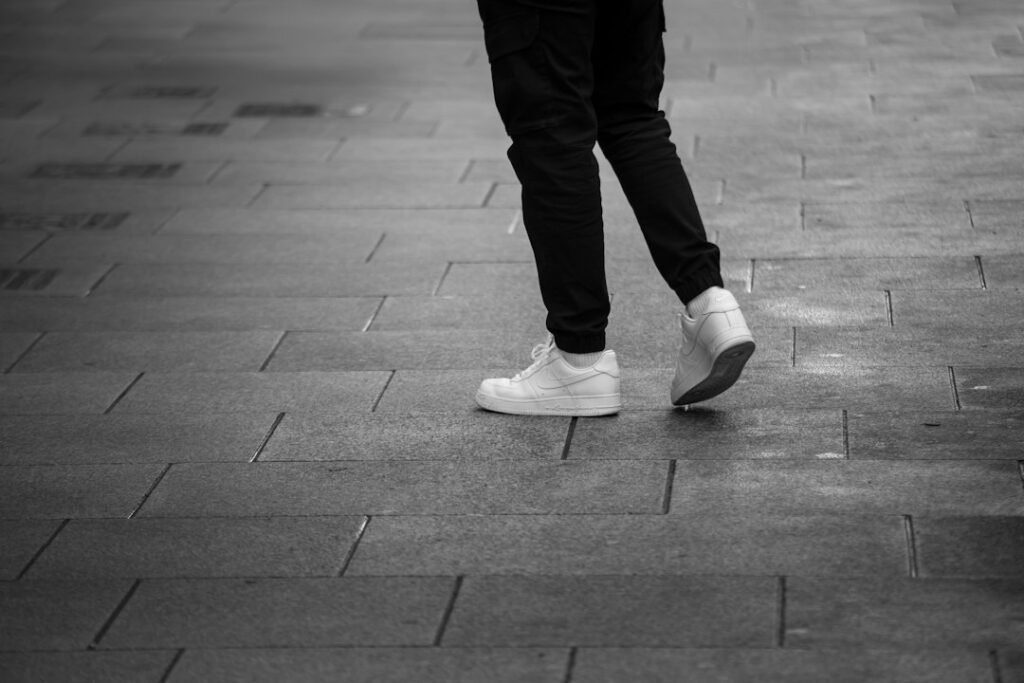 walking sneakers on a sidewalk