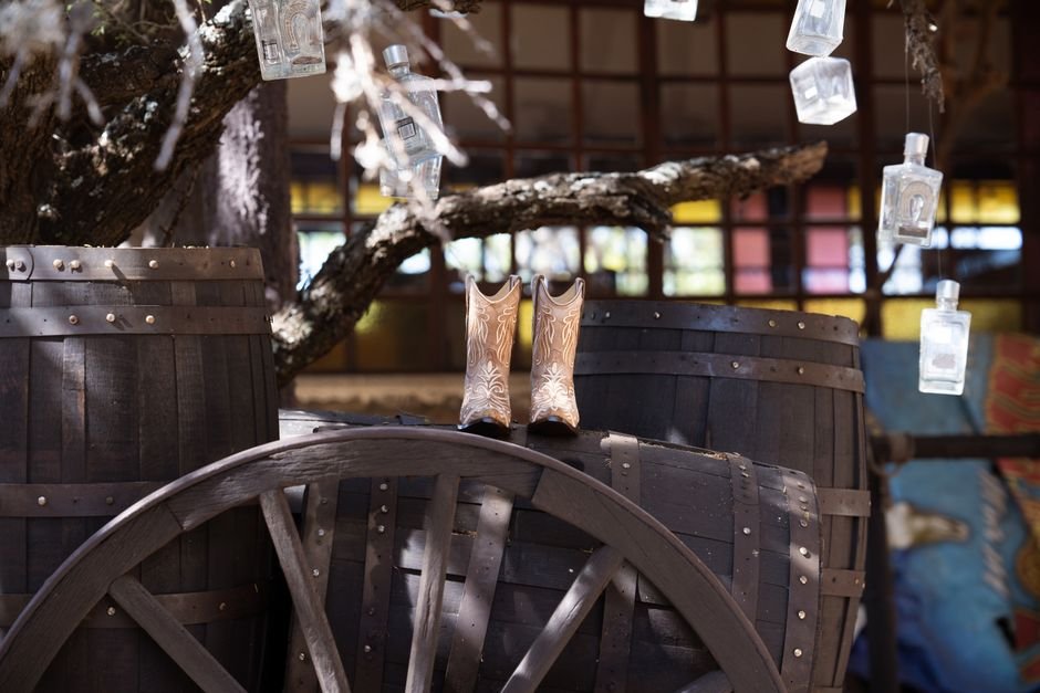 supportive cowboy boots on a wooden porch